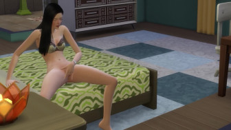 Asian masturbates on the bed
